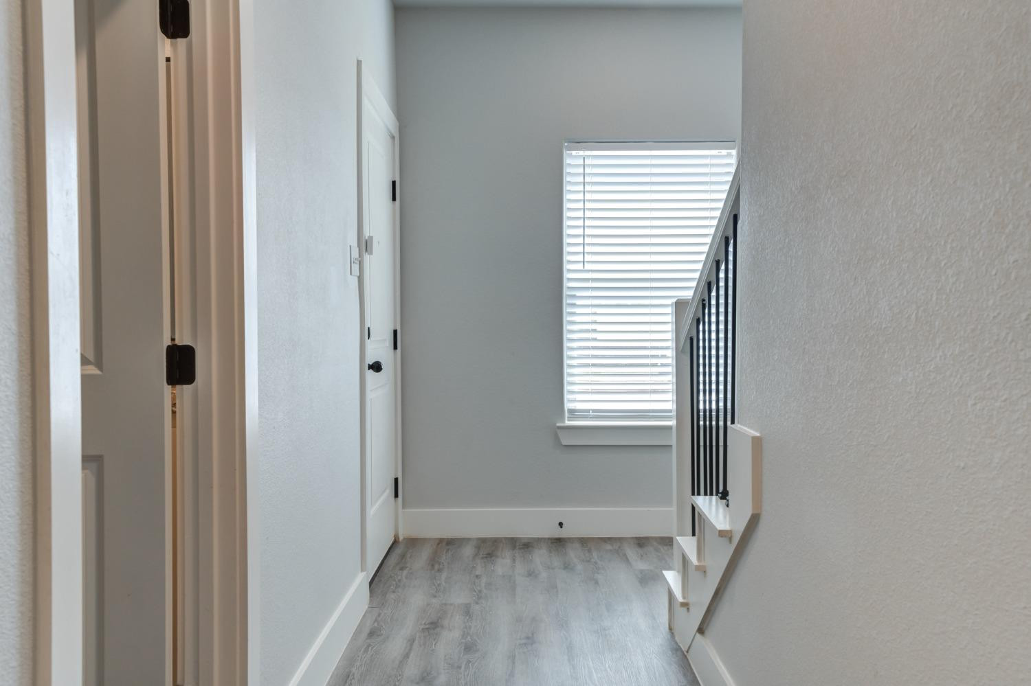 2528 137th Street Lubbock, TX 79423 - Photo 3 of 35 a view of an empty room with wooden floor and a window