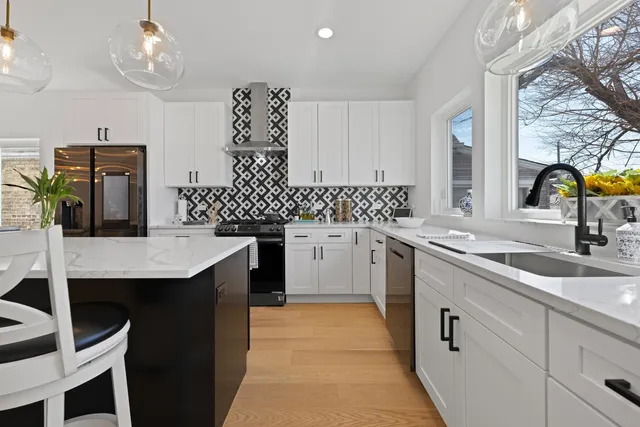 a kitchen with a sink cabinets and window