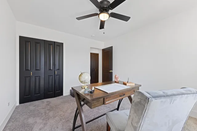 a workspace with furniture and window