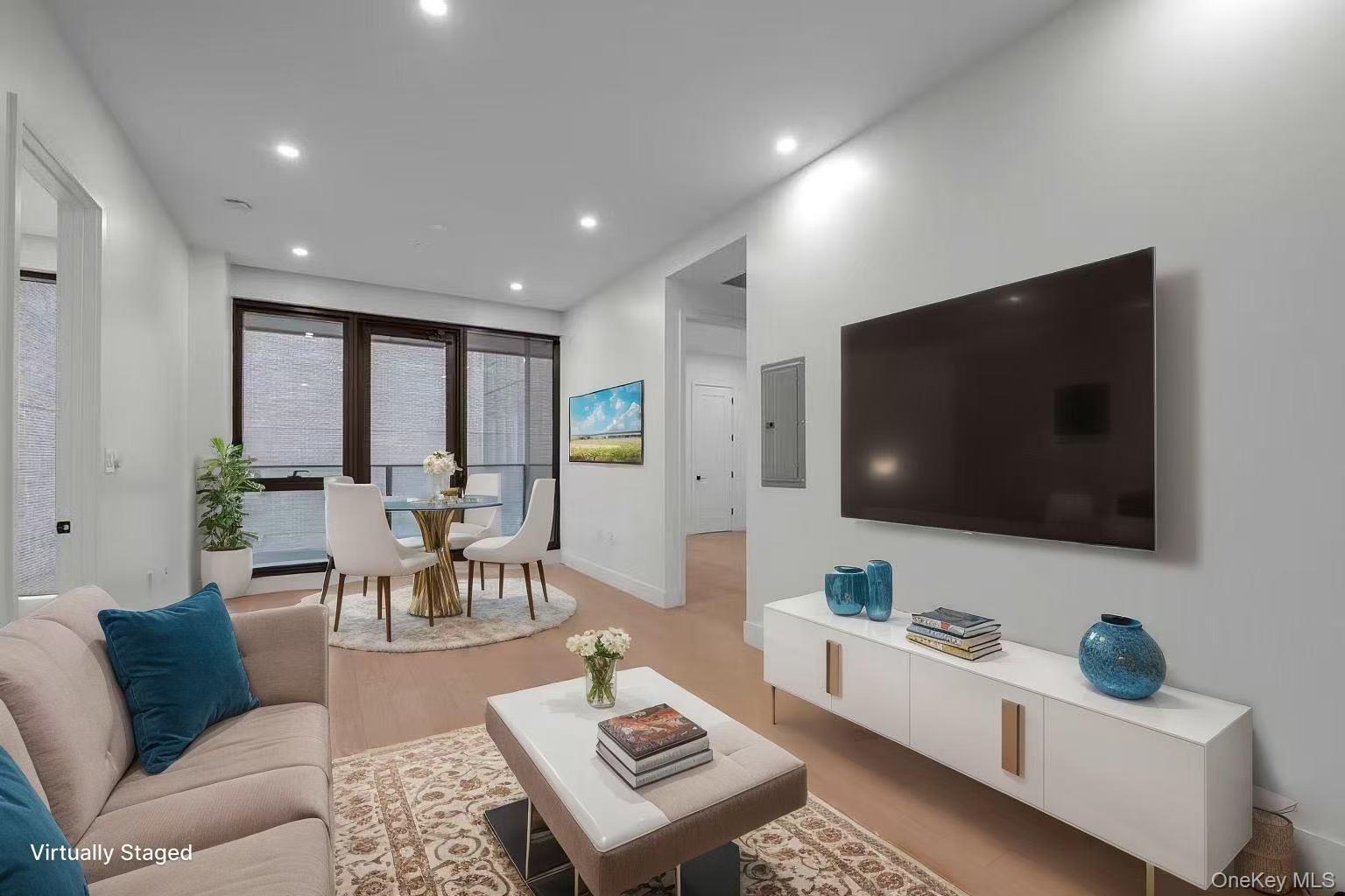 5 Ct Square West, Unit 6A Queens, NY 11101 - Photo 4 of 16 Living room with recessed lighting, light wood-style floors, and electric panel