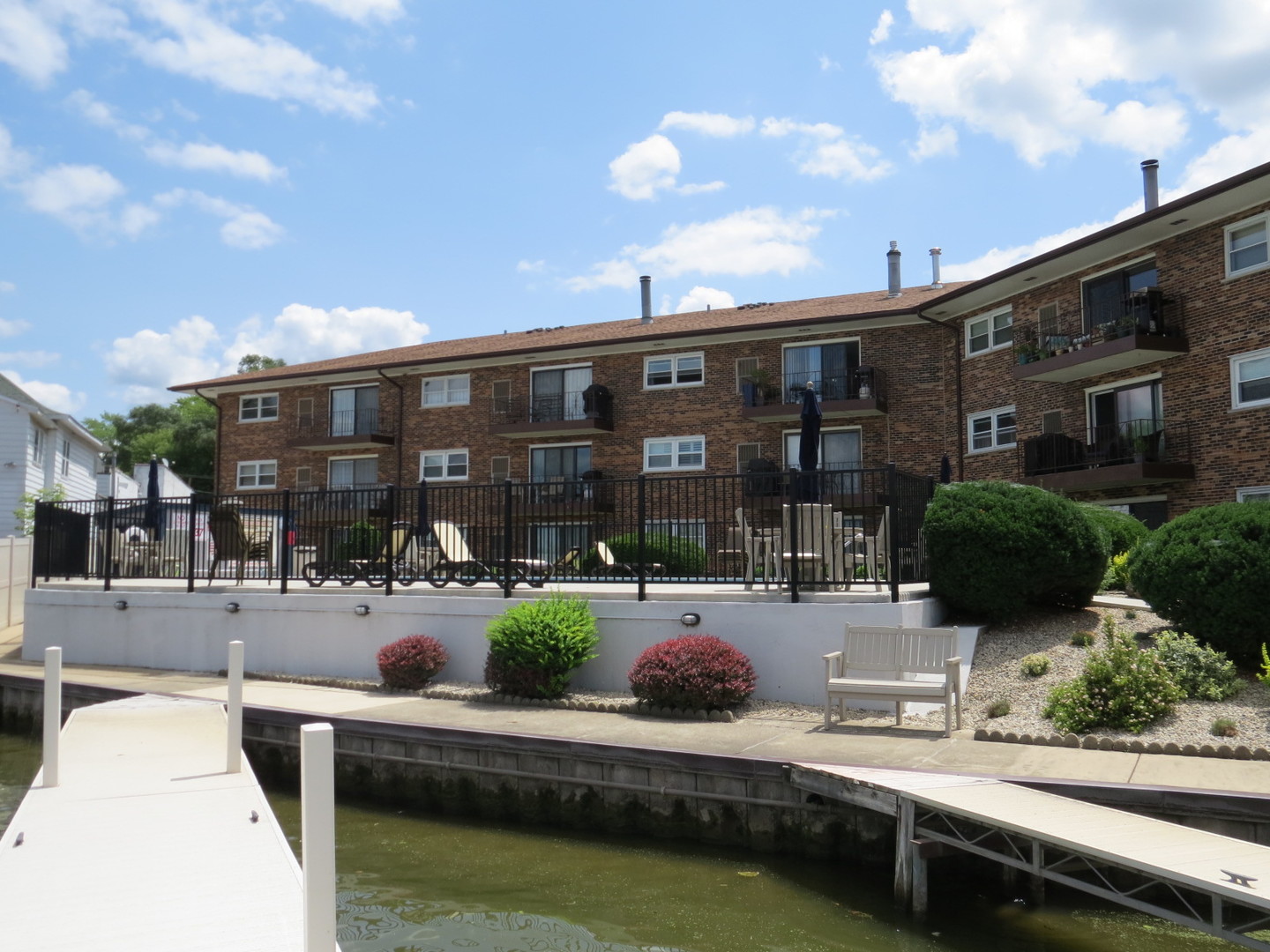 24 North Pistakee Lake Road, Unit 2D Fox Lake, IL 60020 - Photo 13 of 30 a view of house with yard outdoor seating and city view