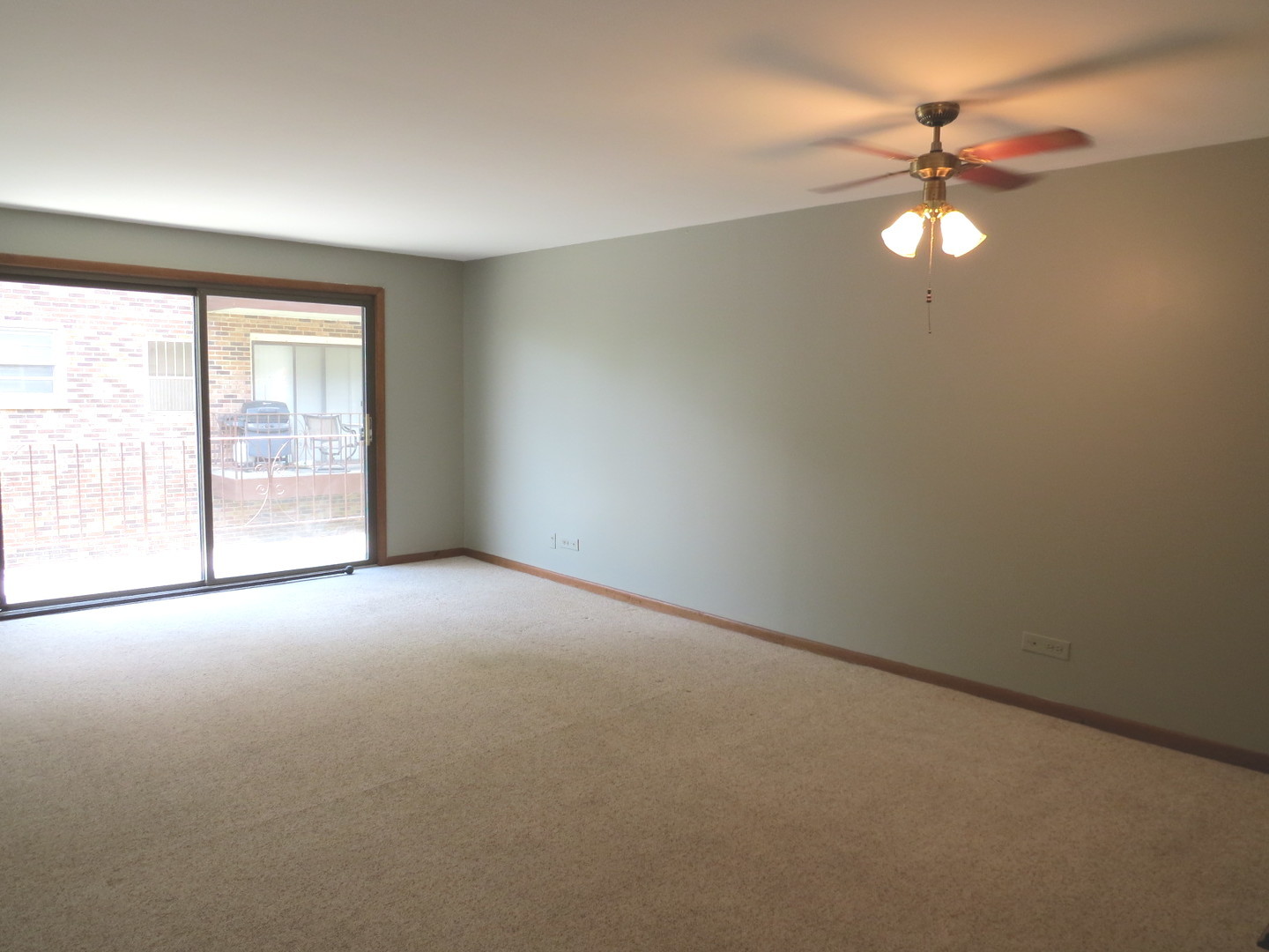24 North Pistakee Lake Road, Unit 2D Fox Lake, IL 60020 - Photo 17 of 30 an empty room with windows and fan