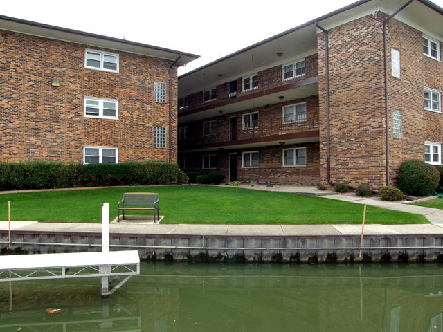 24 North Pistakee Lake Road, Unit 2D Fox Lake, IL 60020 - Photo 2 of 30 a view of a building with a swimming pool