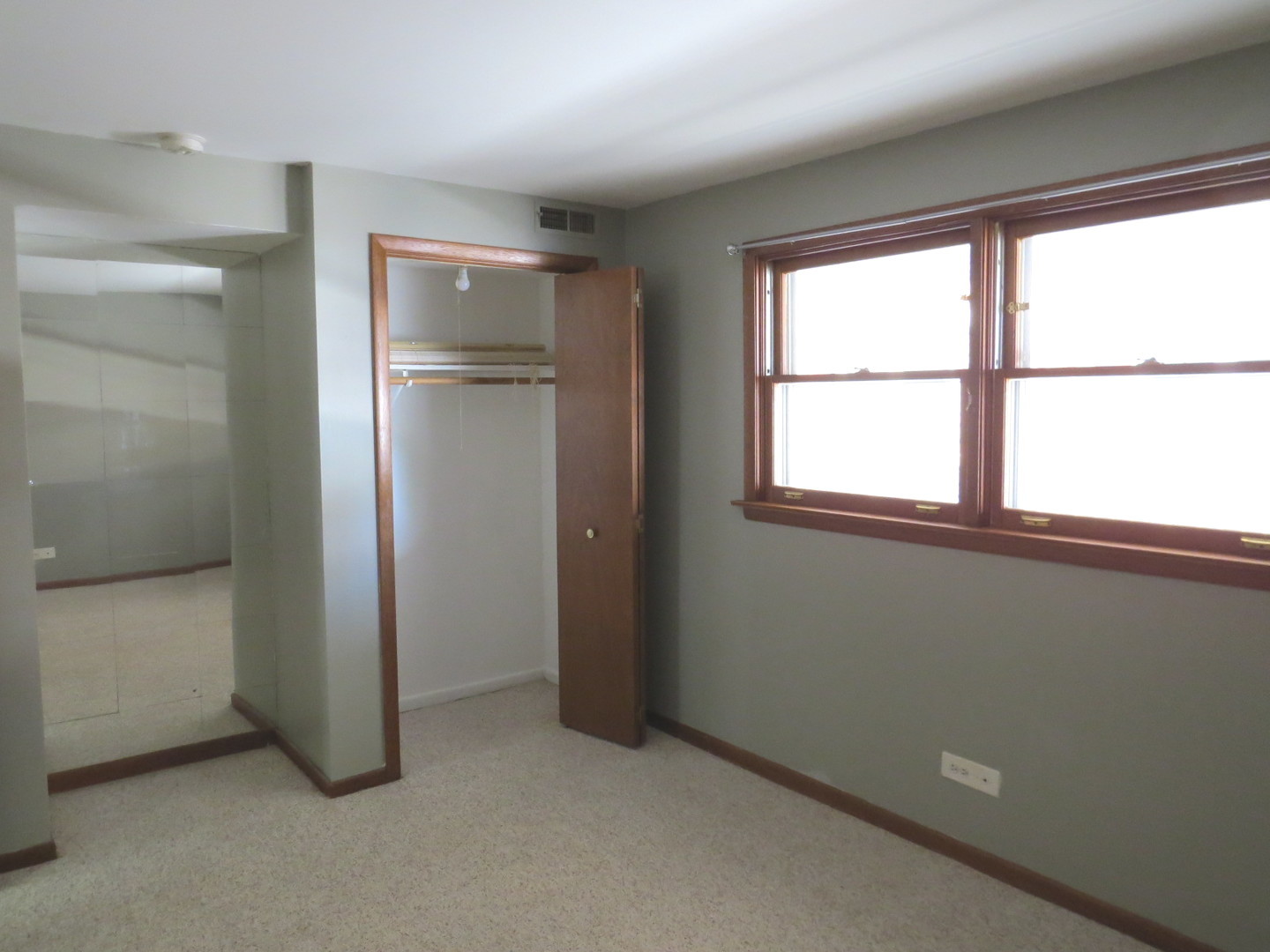 24 North Pistakee Lake Road, Unit 2D Fox Lake, IL 60020 - Photo 25 of 30 an empty room with windows and closet