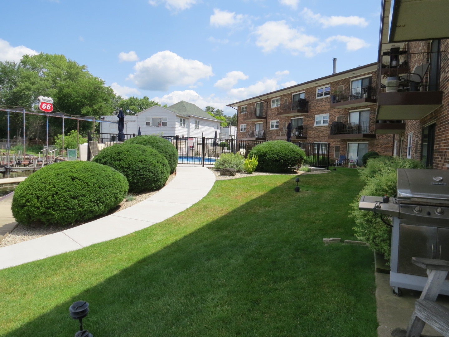 24 North Pistakee Lake Road, Unit 2D Fox Lake, IL 60020 - Photo 10 of 30 a view of a big yard and large trees