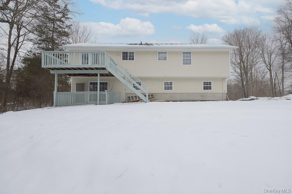 600 Twin Arch Road Rock Tavern, NY 12575 - Photo 22 of 25 Snow covered property featuring a wooden deck and stairs