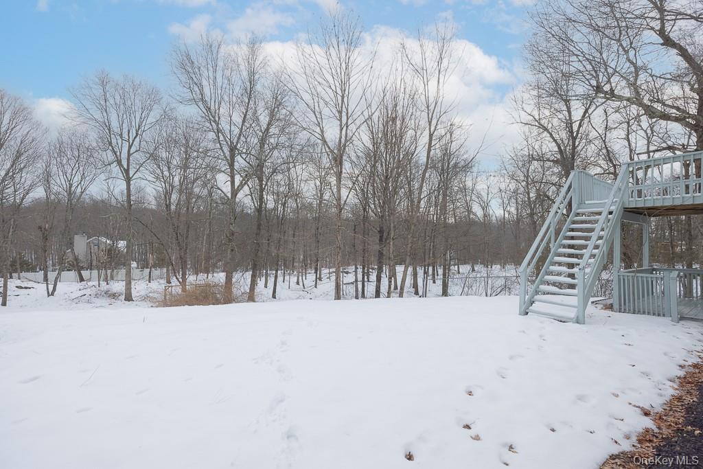 600 Twin Arch Road Rock Tavern, NY 12575 - Photo 25 of 25 Snowy yard featuring stairway and a deck