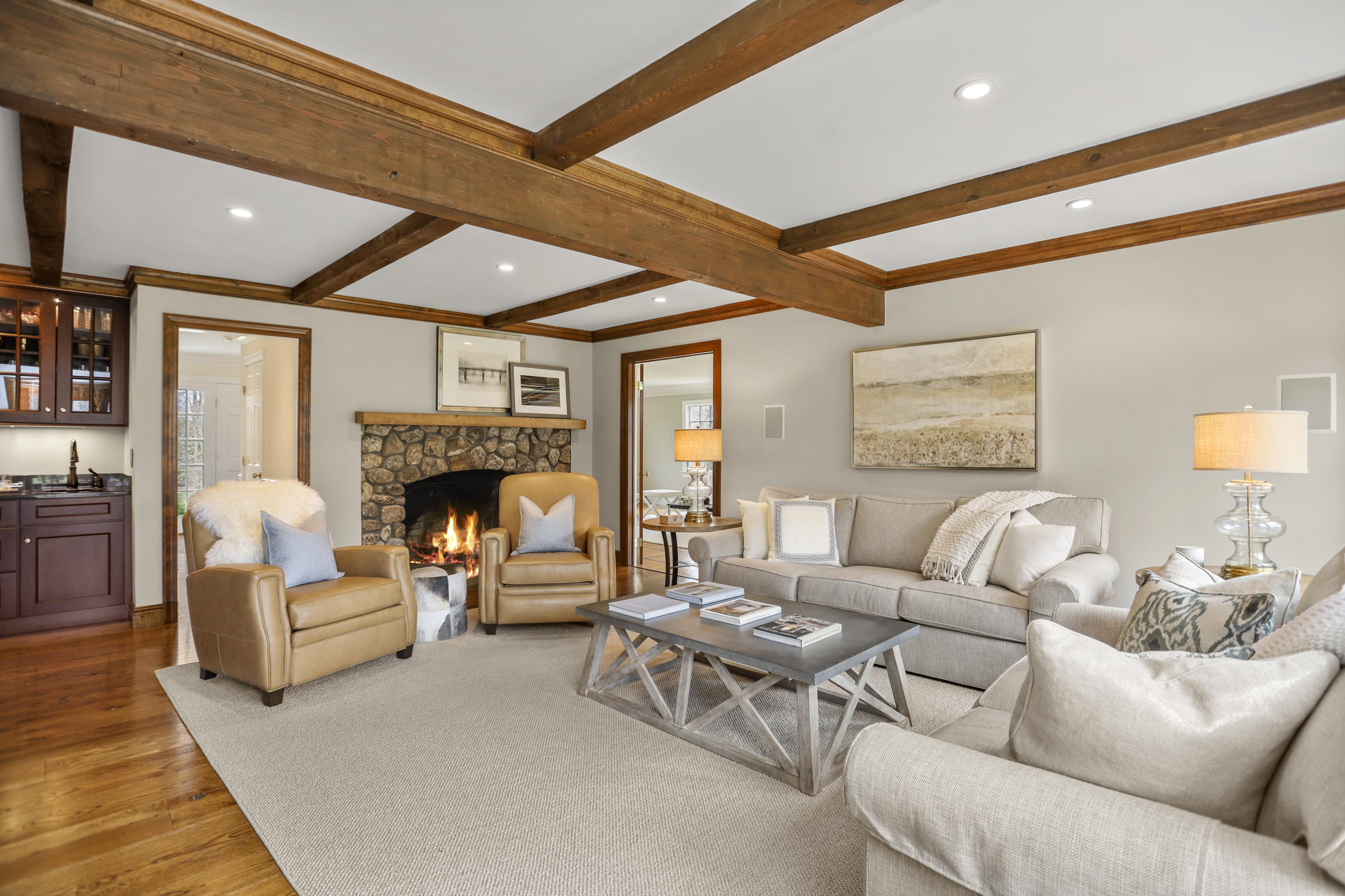 501 Brookside Road New Canaan, CT 06840 - Photo 11 of 38 a living room with furniture a fireplace and a large window