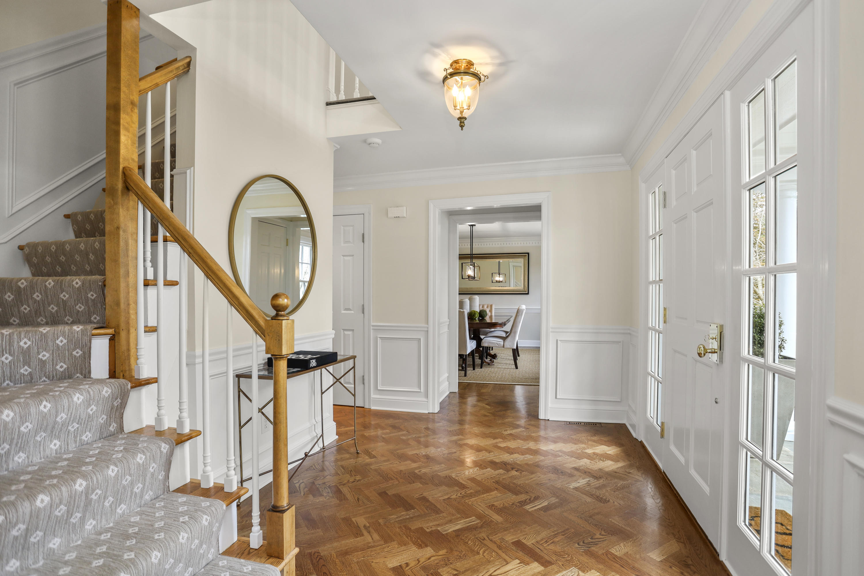 501 Brookside Road New Canaan, CT 06840 - Photo 15 of 38 a view of a livingroom with wooden floor and staircase