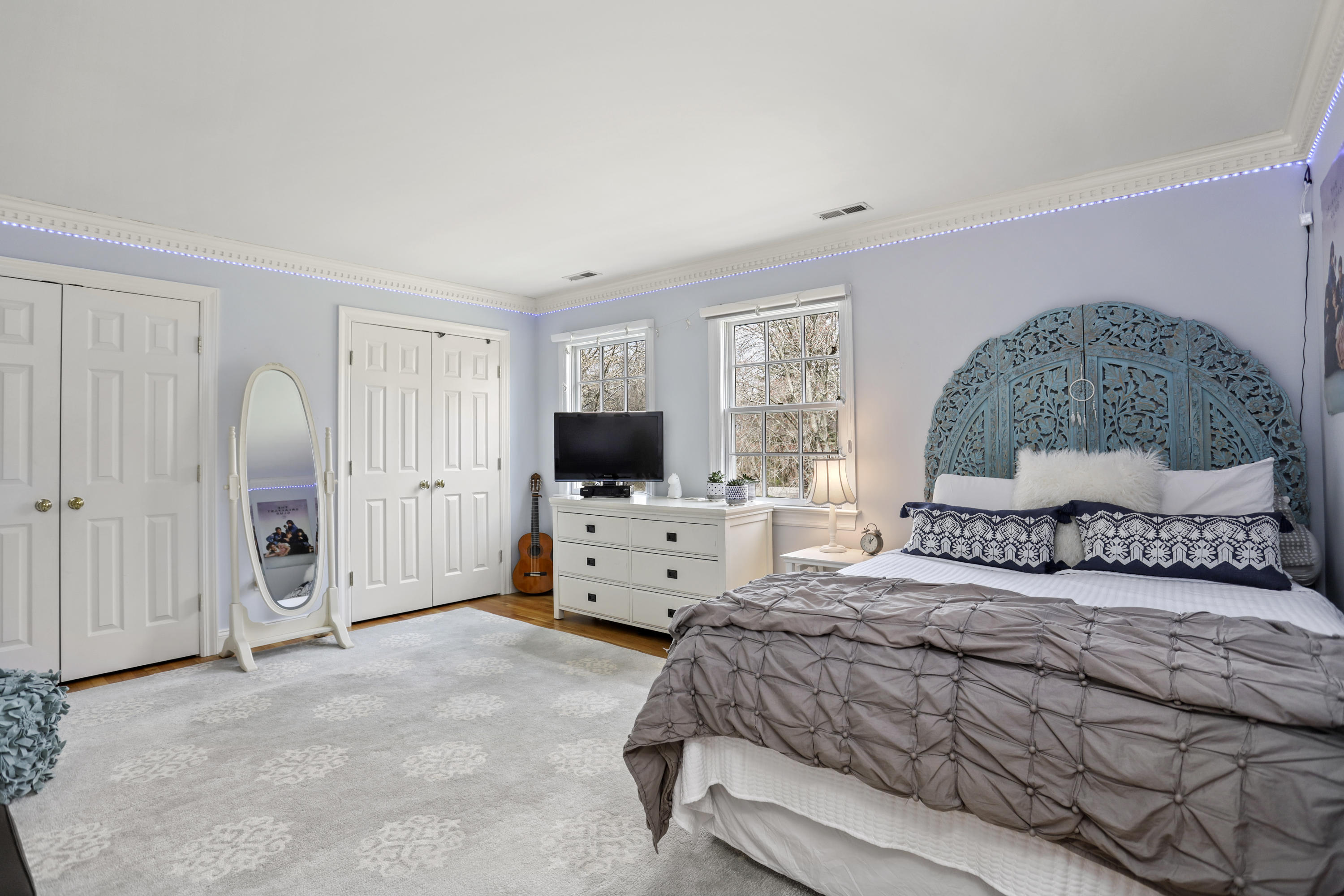501 Brookside Road New Canaan, CT 06840 - Photo 20 of 38 a bedroom with a large bed and a flat tv screen on the dresser