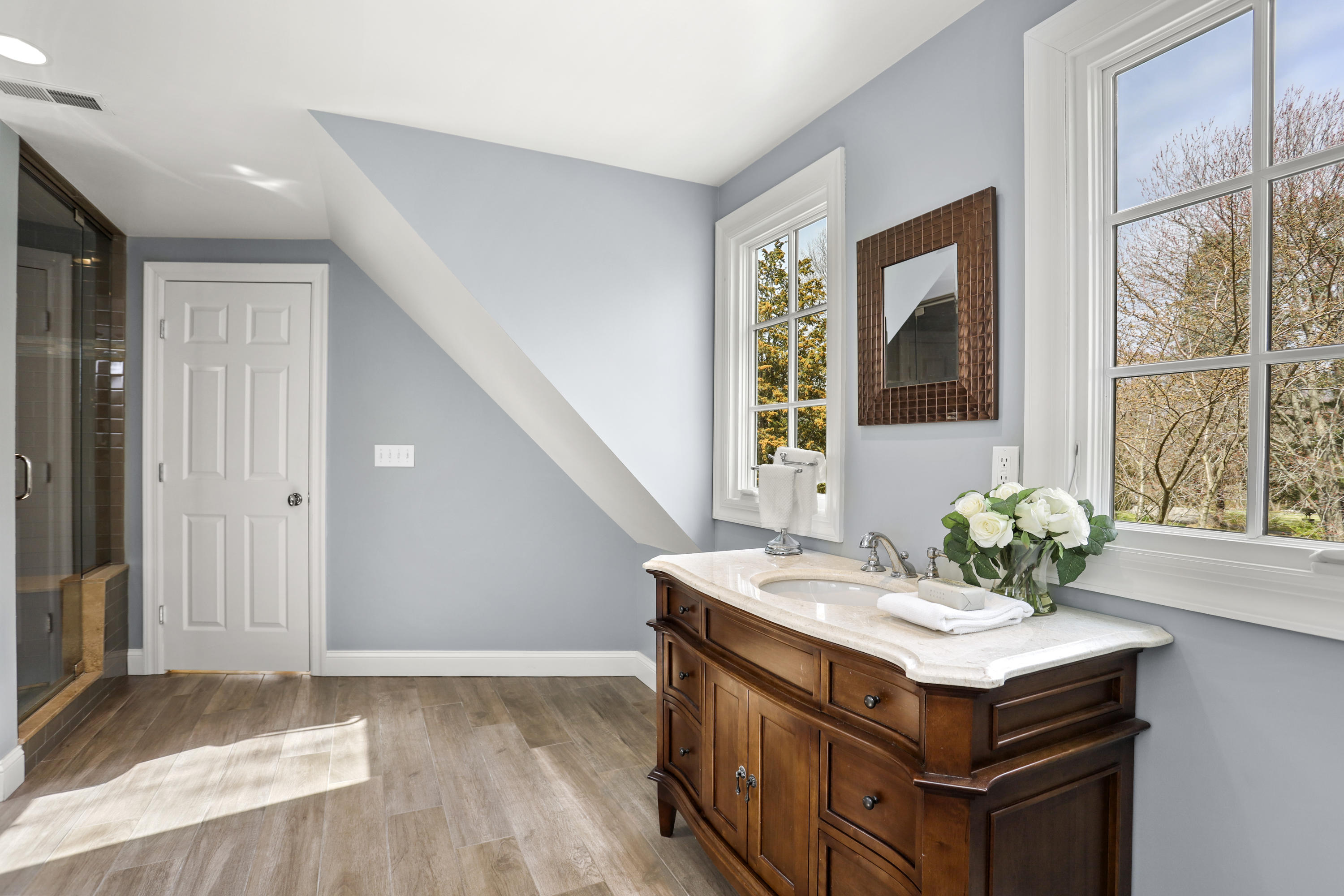 501 Brookside Road New Canaan, CT 06840 - Photo 24 of 38 a bathroom with a sink and a window