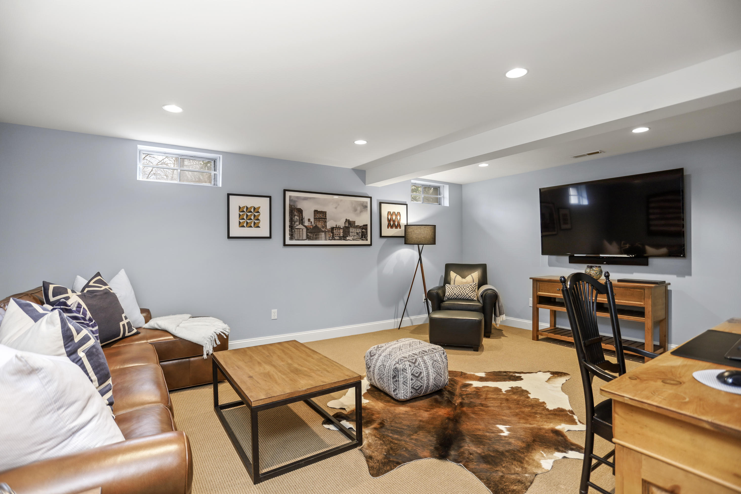 501 Brookside Road New Canaan, CT 06840 - Photo 30 of 38 a living room with furniture and a flat screen tv