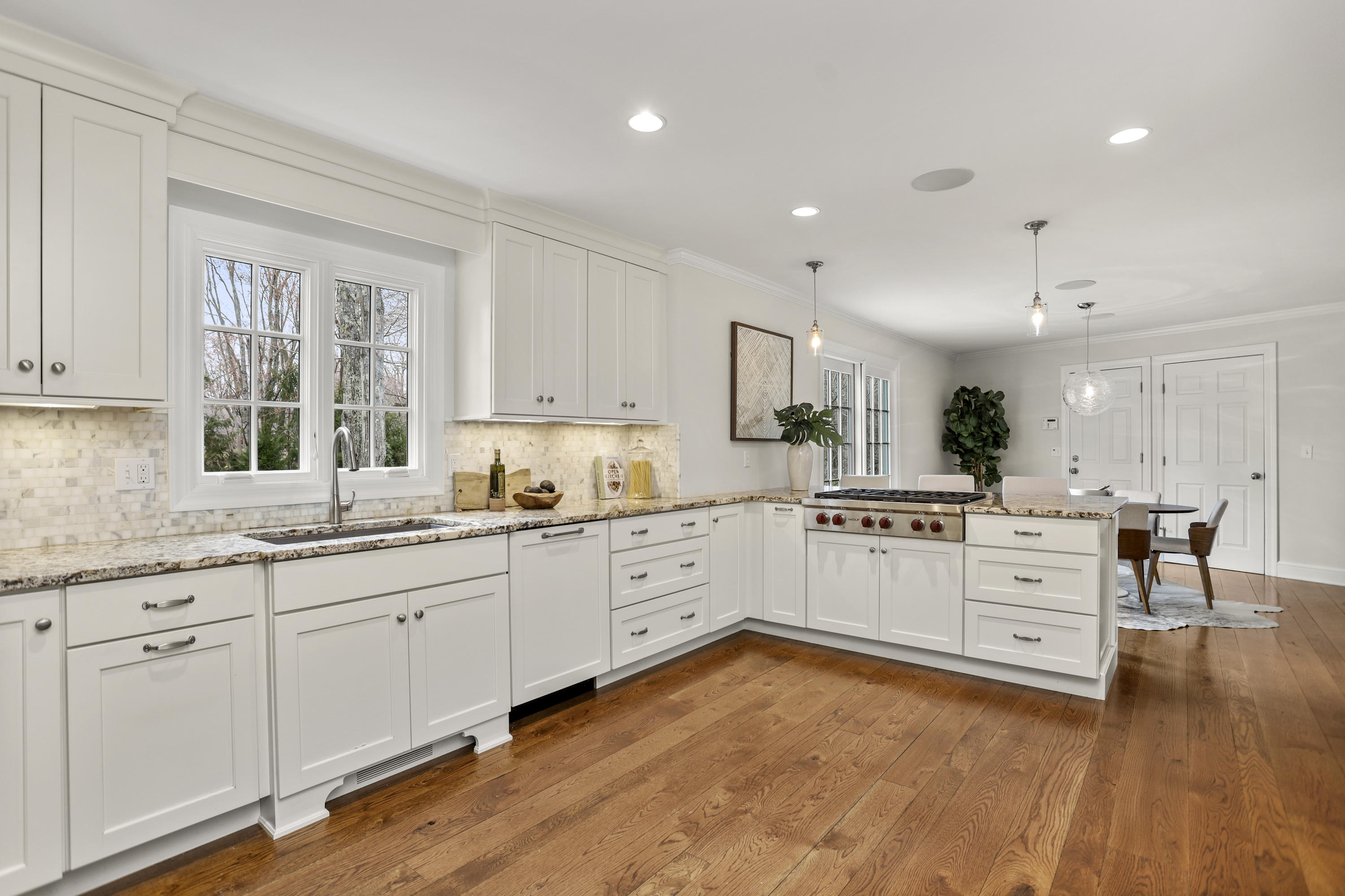 501 Brookside Road New Canaan, CT 06840 - Photo 4 of 38 a kitchen with white cabinets and white appliances