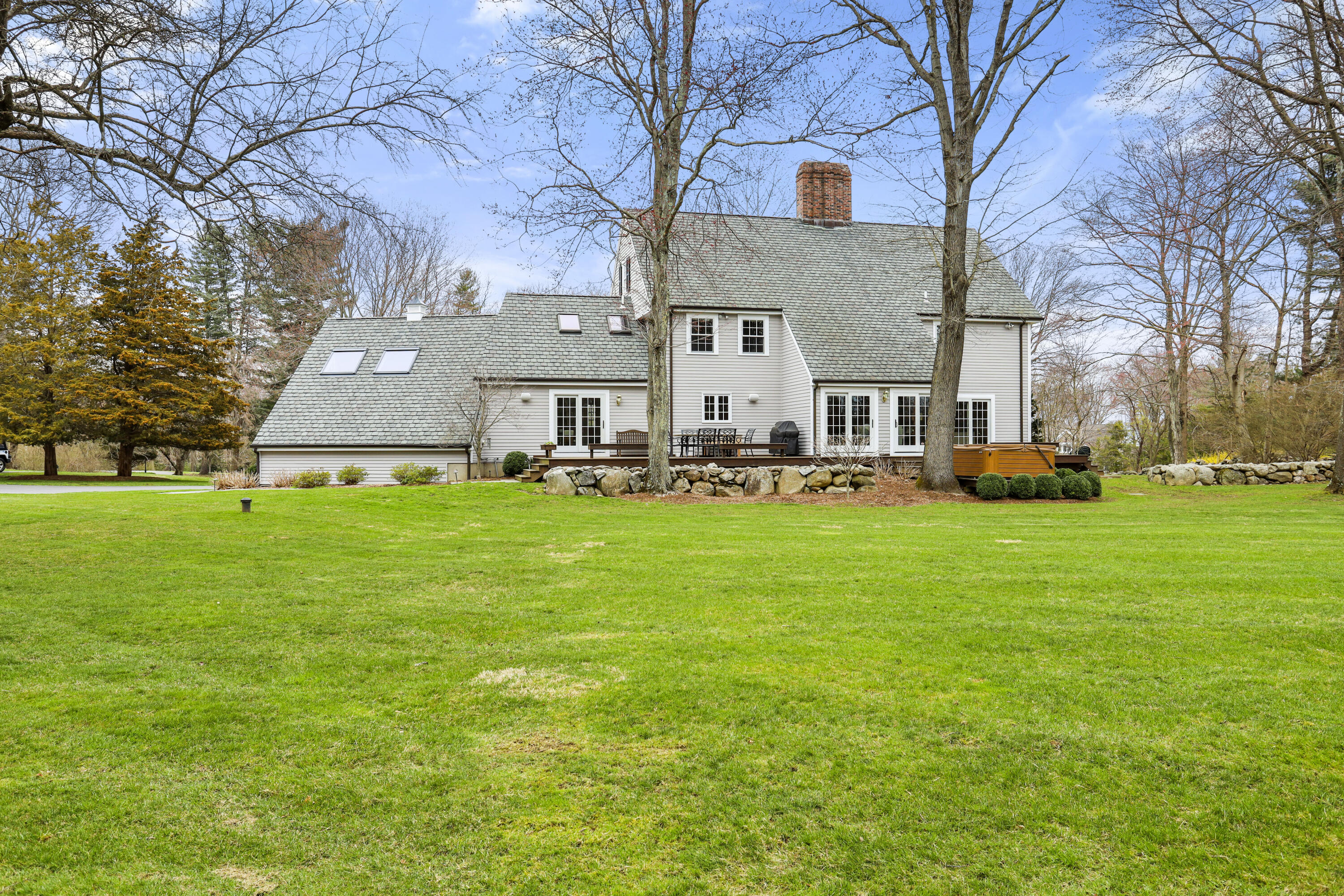 501 Brookside Road New Canaan, CT 06840 - Photo 32 of 38 a front view of building with garden