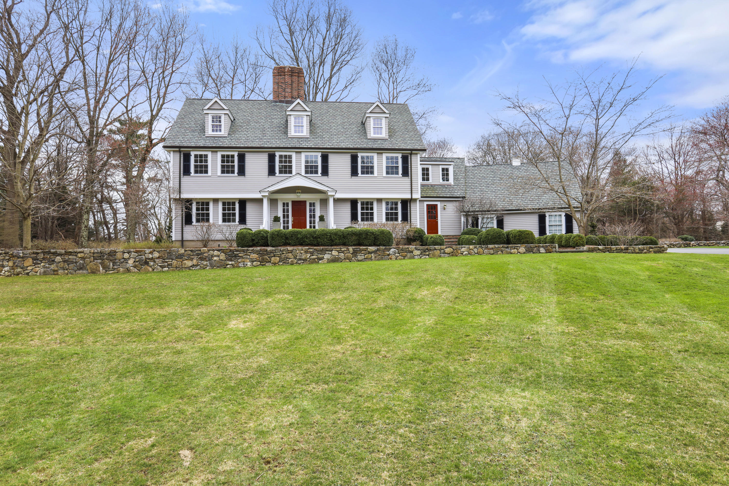501 Brookside Road New Canaan, CT 06840 - Photo 34 of 38 a front view of a house with a yard
