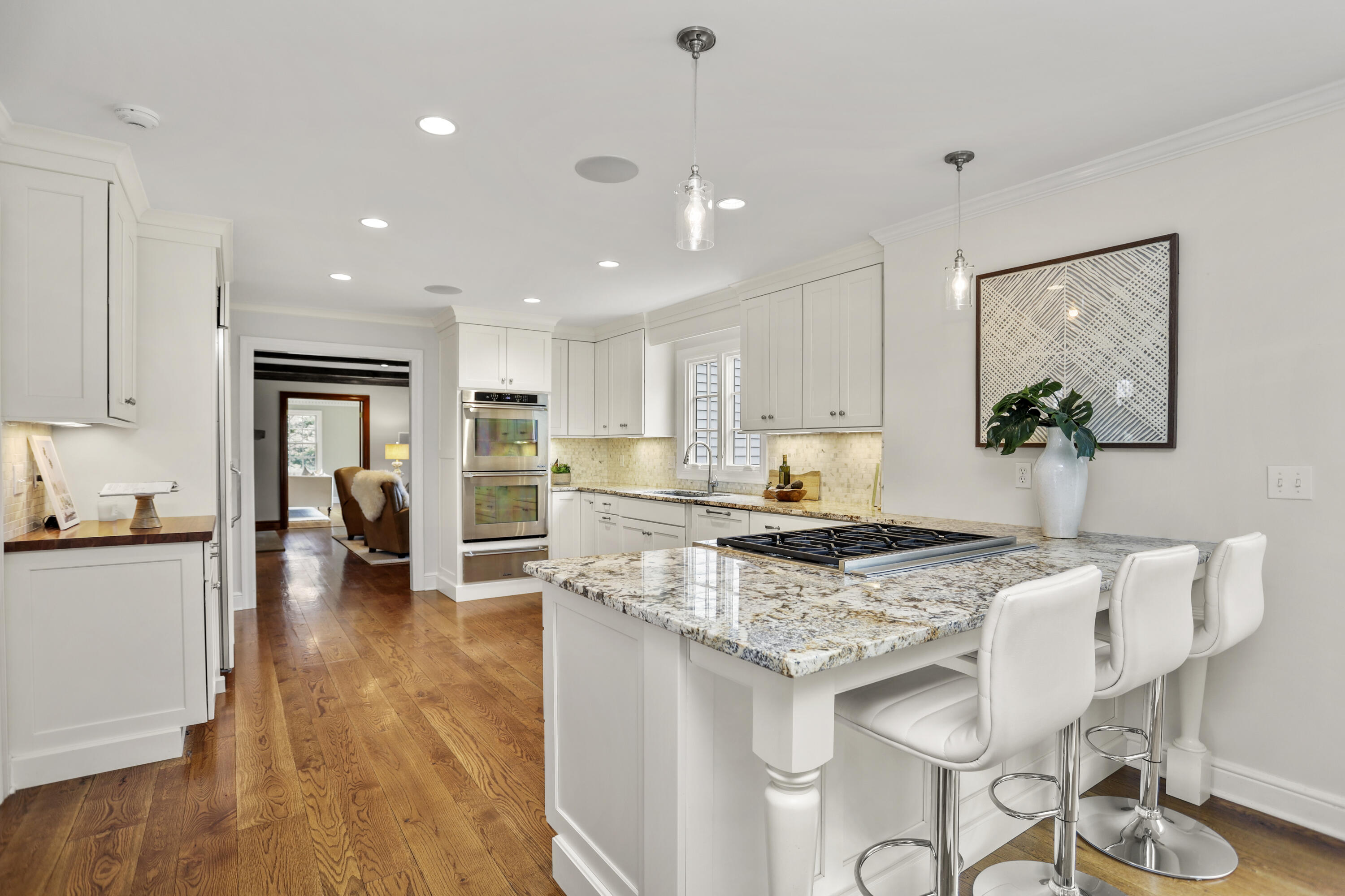 501 Brookside Road New Canaan, CT 06840 - Photo 5 of 38 a kitchen with granite countertop kitchen island white cabinets and stainless steel appliances