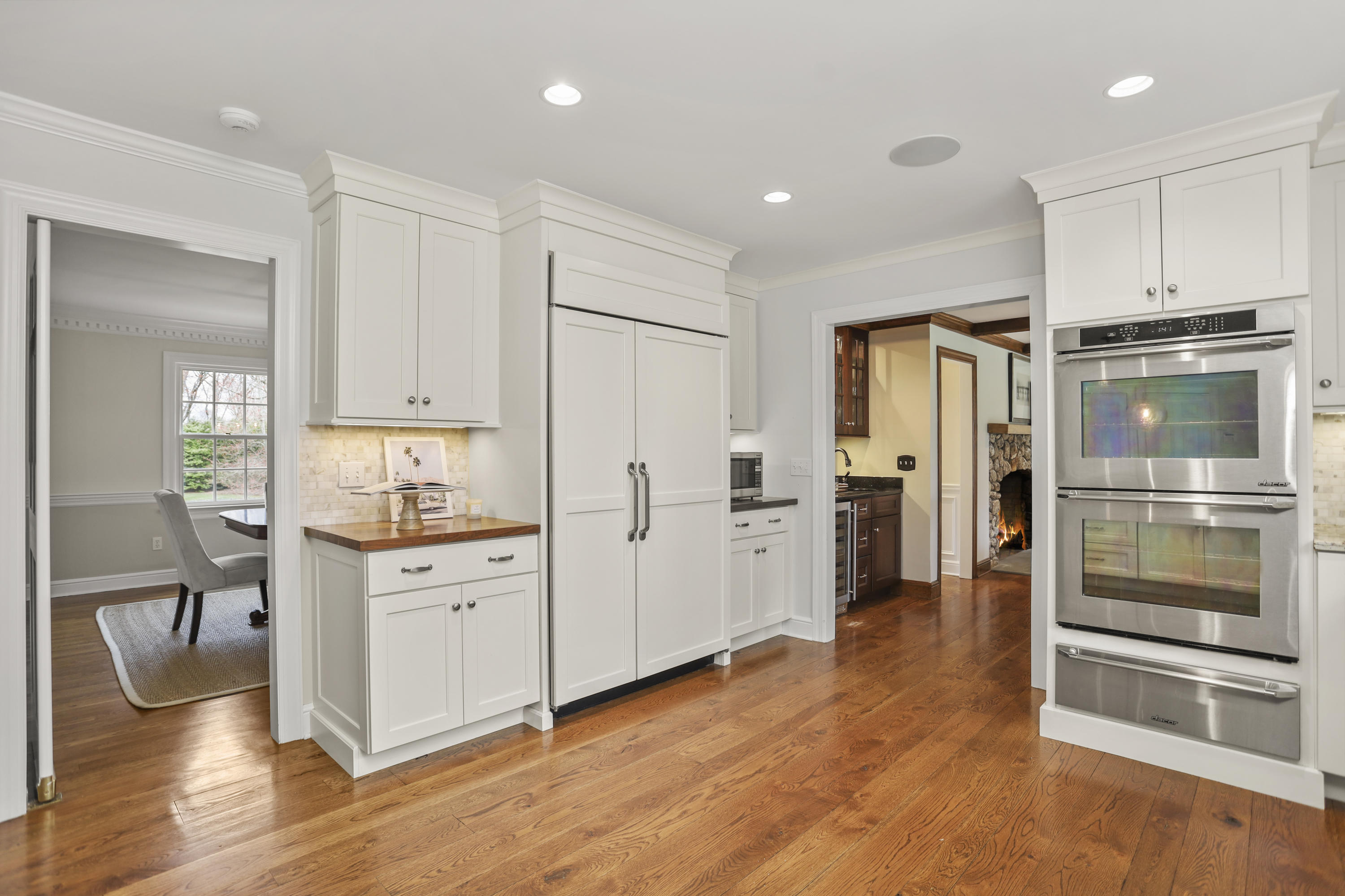 501 Brookside Road New Canaan, CT 06840 - Photo 9 of 38 a kitchen with white cabinets and stainless steel appliances