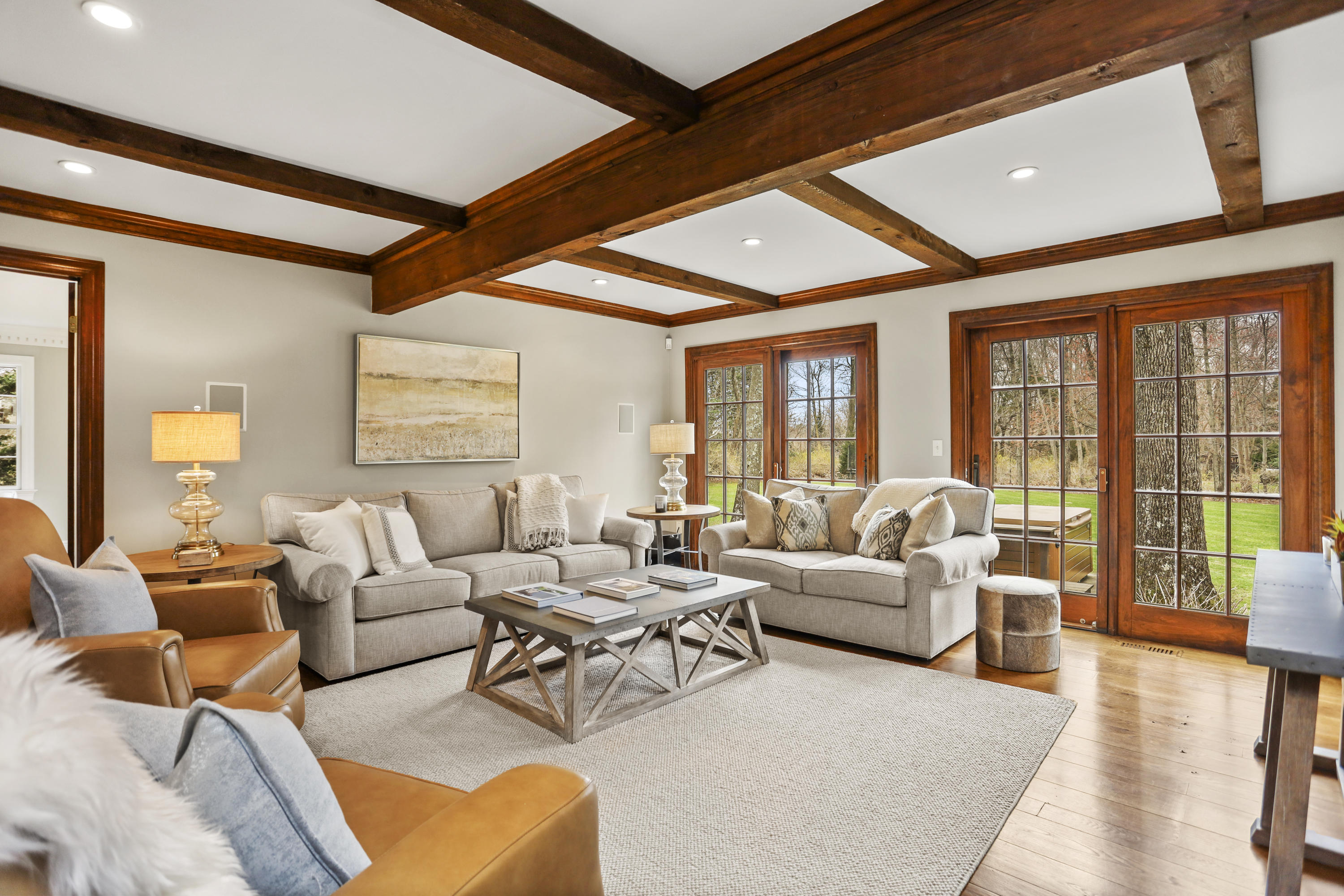 501 Brookside Road New Canaan, CT 06840 - Photo 10 of 38 a living room with furniture ceiling fan and a large window