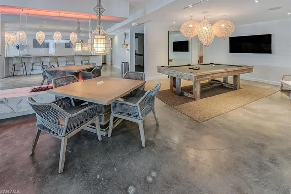 a kitchen with stainless steel appliances a refrigerator sink and cabinets