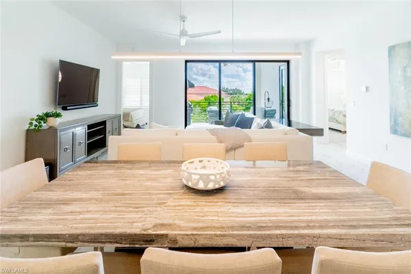 a bedroom with a bed and a flat screen television