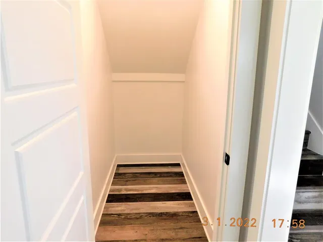 a view of staircase with white walls