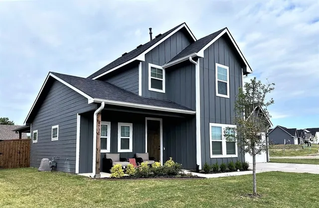 front view of a house with a yard