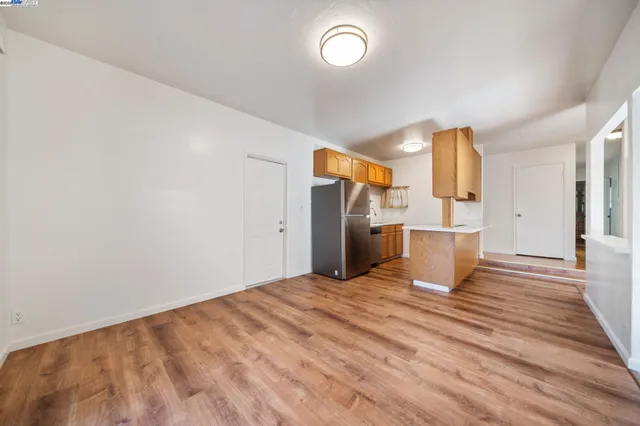 a view of a kitchen with wooden floor
