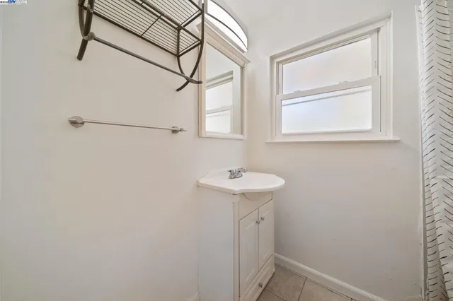 a bathroom with a sink and washing machine