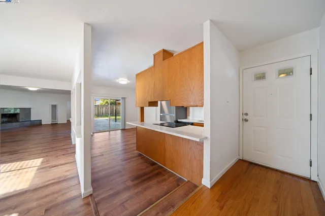 a kitchen with stainless steel appliances granite countertop a sink and cabinets