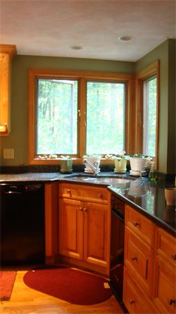 20 Squannacook Road Shirley, MA 01464 - Photo 9 of 10 a kitchen with stainless steel appliances granite countertop a sink and a large window