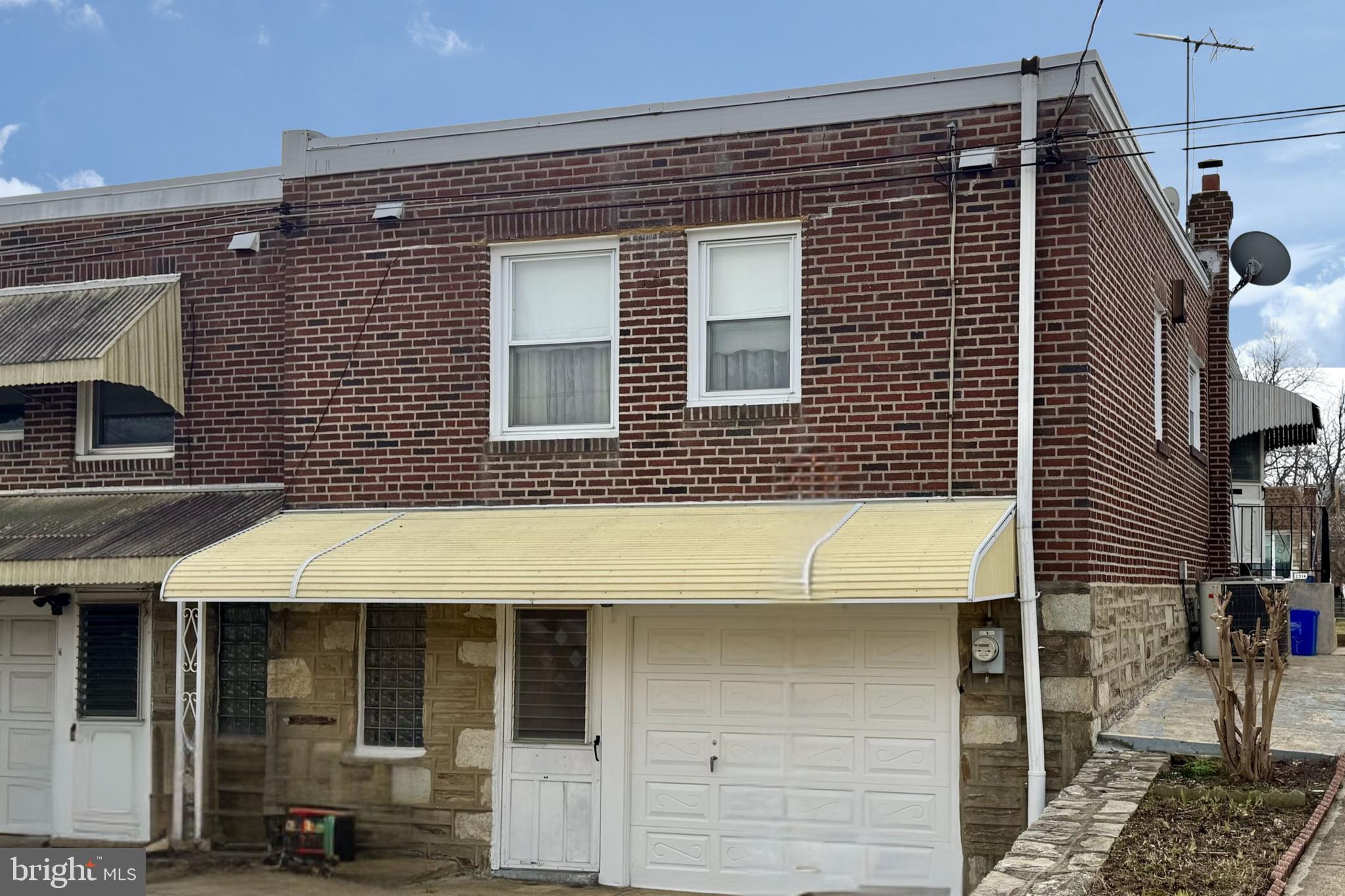 2317 Emerson Street Philadelphia, PA 19152 - Photo 17 of 18 a view of a brick house with large windows