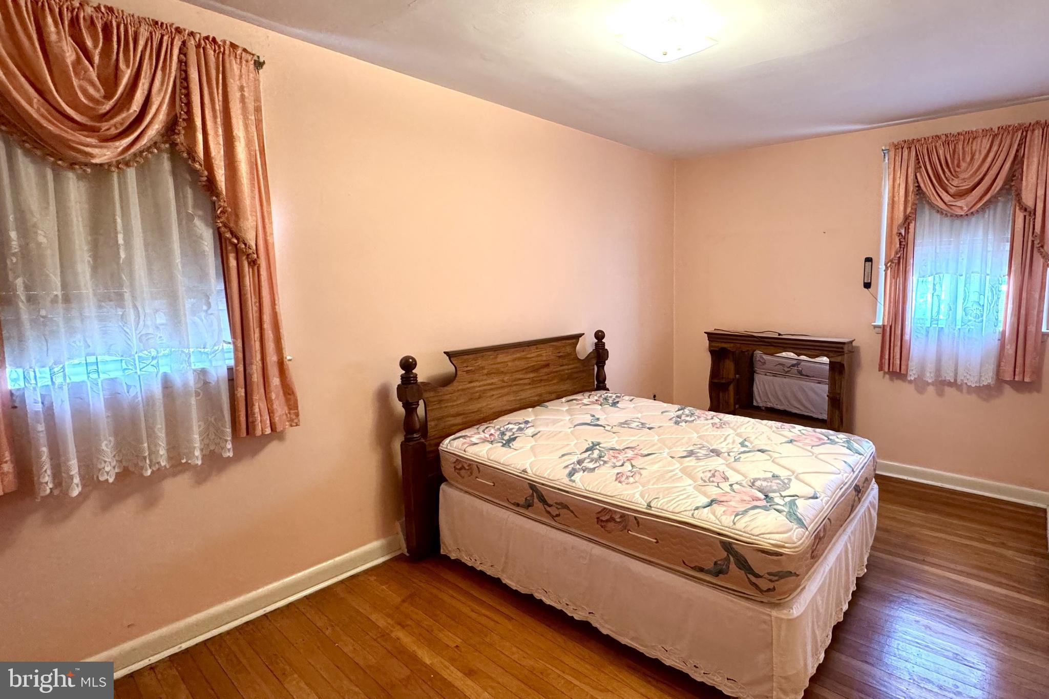 2317 Emerson Street Philadelphia, PA 19152 - Photo 10 of 18 a room with a bed and a dresser