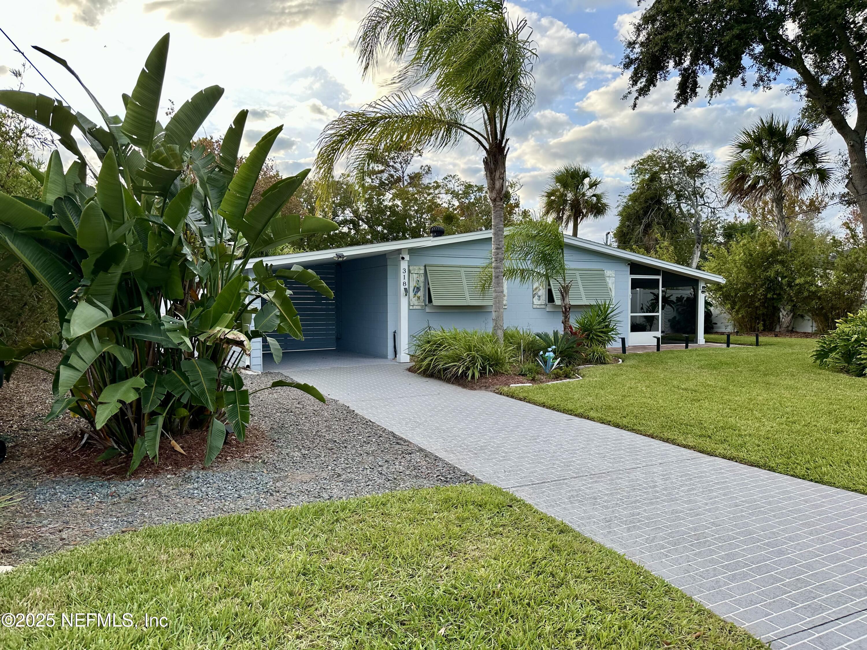 318 Royal Palms Drive Atlantic Beach, FL 32233 - Photo 2 of 39 a front view of house with a garden