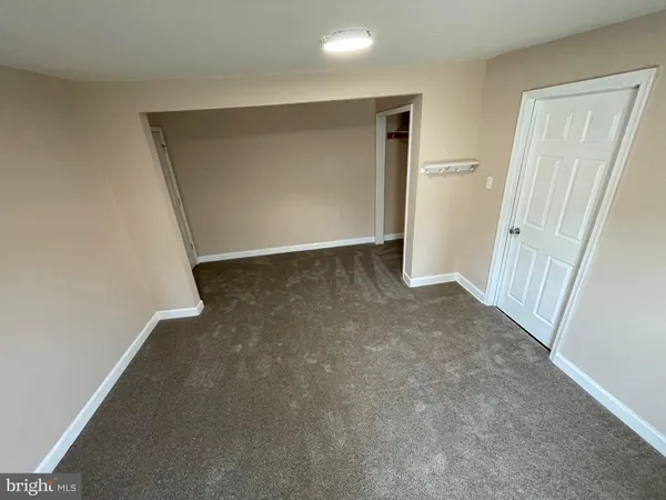 an empty room with a hallway