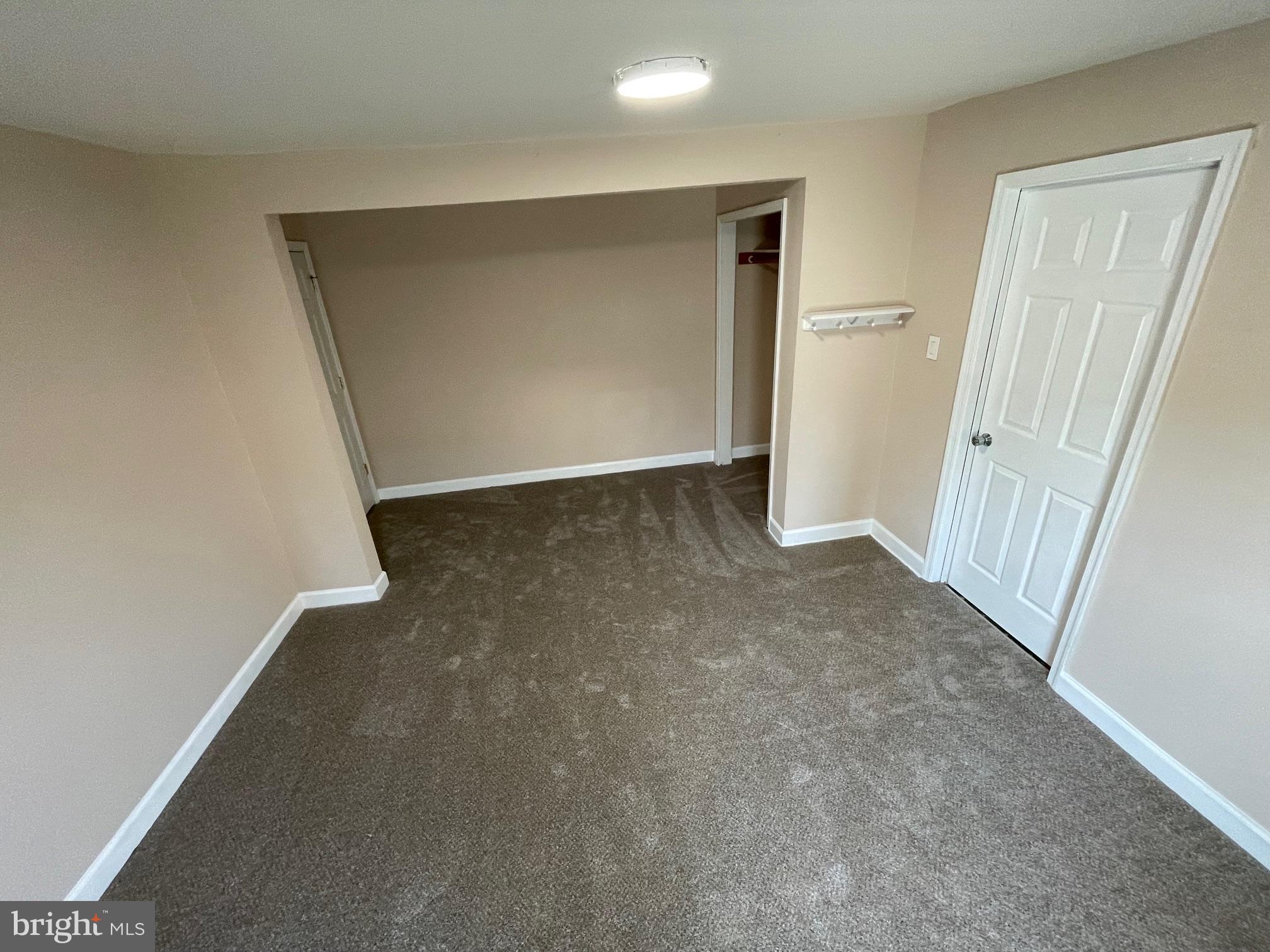 1339 U Street Southeast Washington, DC 20020 - Photo 13 of 23 an empty room with a hallway