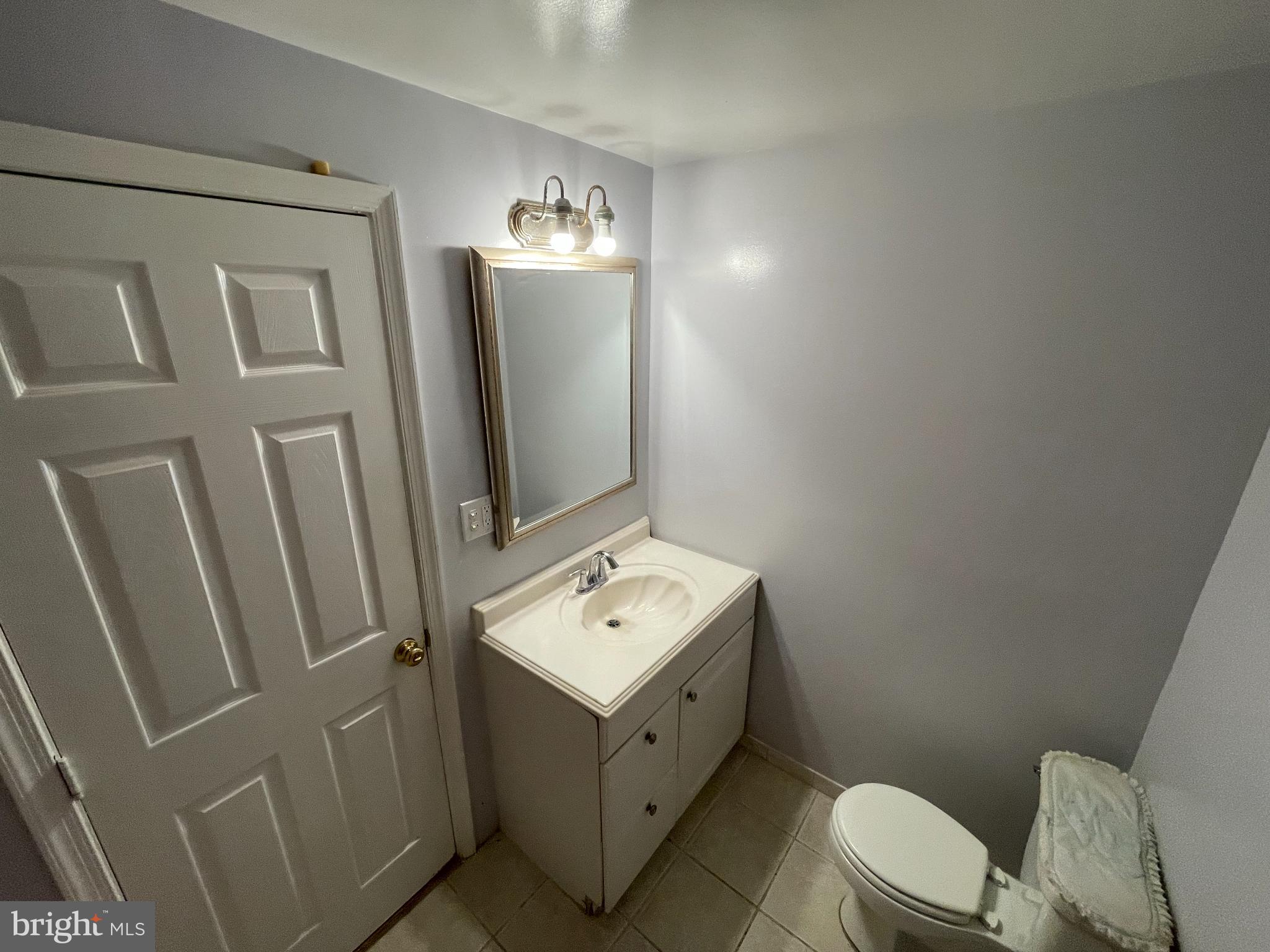 1339 U Street Southeast Washington, DC 20020 - Photo 15 of 23 a bathroom with a toilet sink and mirror