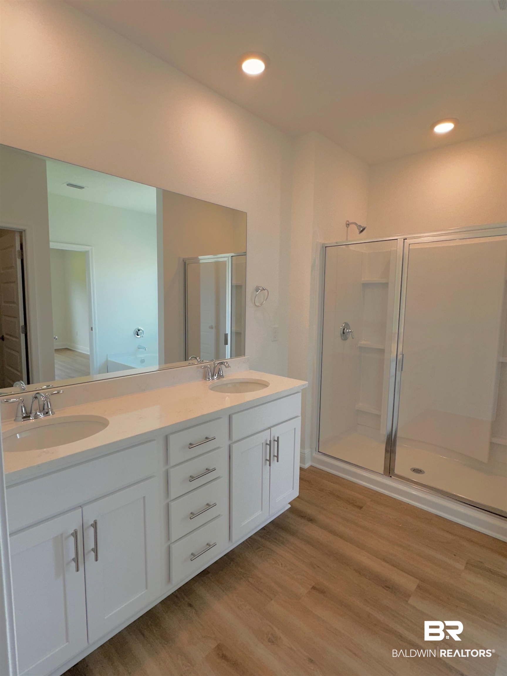 12946 Grand Rpds Road Fairhope, AL 36532 - Photo 11 of 19 Bathroom with dual vanity, hardwood / wood-style flooring, and walk in shower
