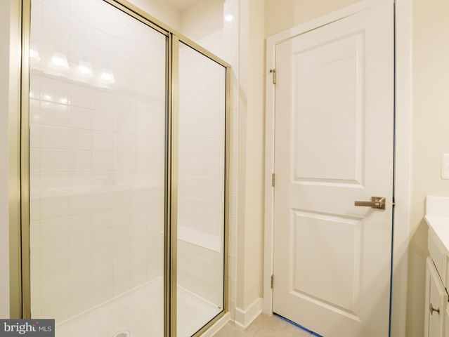 a view of a bathroom with a glass shower door