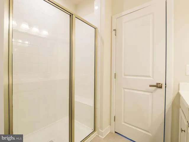 a view of a bathroom with a glass shower door