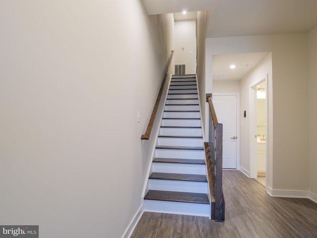 a view of entryway with wooden floor