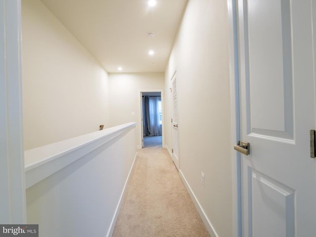 a view of a storage & utility room with a washer dryer