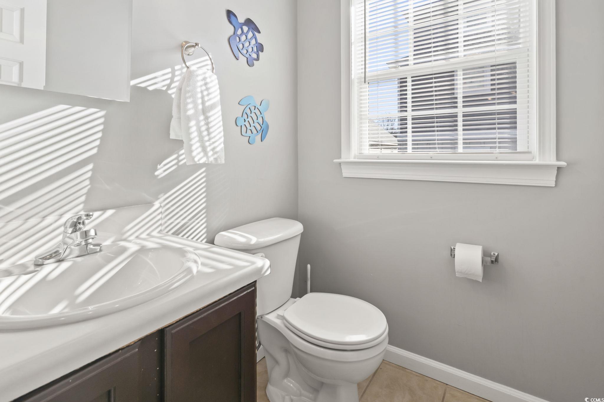 409 Knoll Court Myrtle Beach, SC 29588 - Photo 15 of 33 Bathroom with vanity and light tile patterned flooring