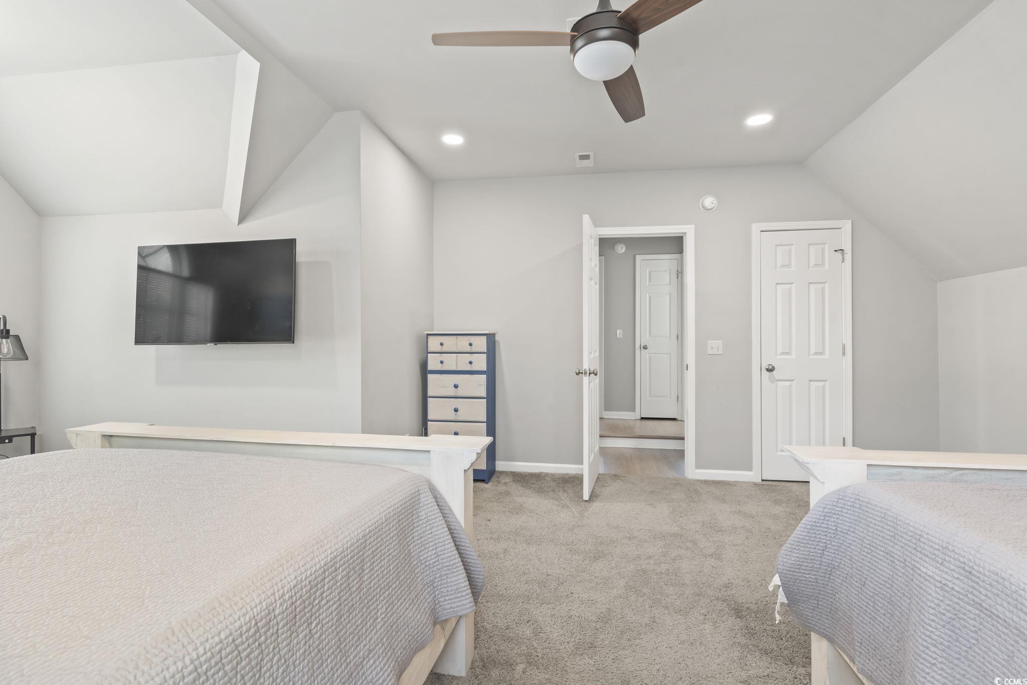 409 Knoll Court Myrtle Beach, SC 29588 - Photo 20 of 33 Bedroom featuring vaulted ceiling, ceiling fan, light carpet, and recessed lighting
