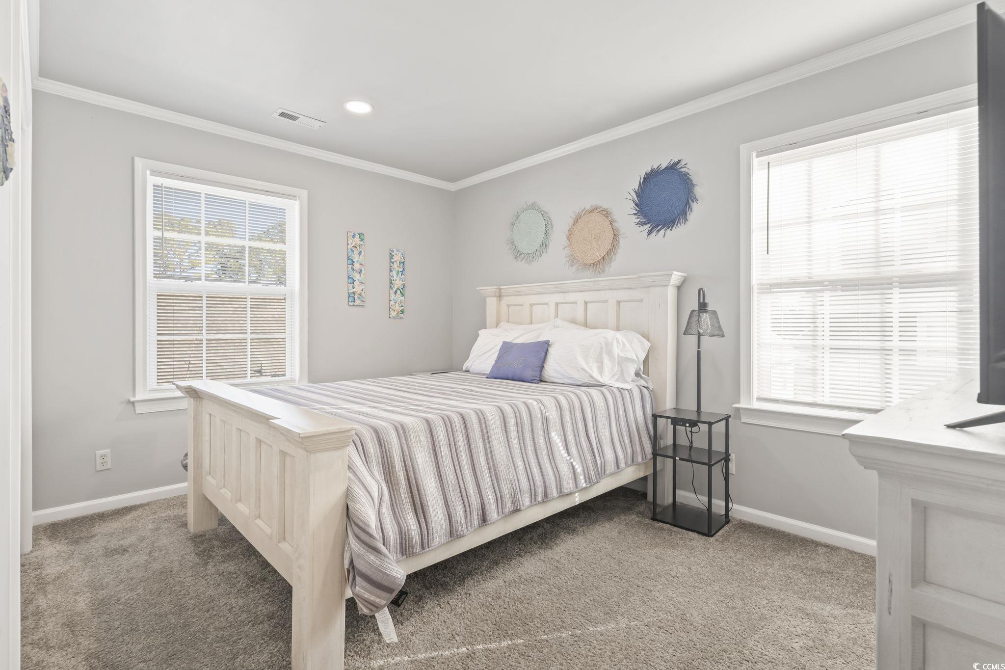 409 Knoll Court Myrtle Beach, SC 29588 - Photo 24 of 33 Carpeted bedroom with crown molding and recessed lighting