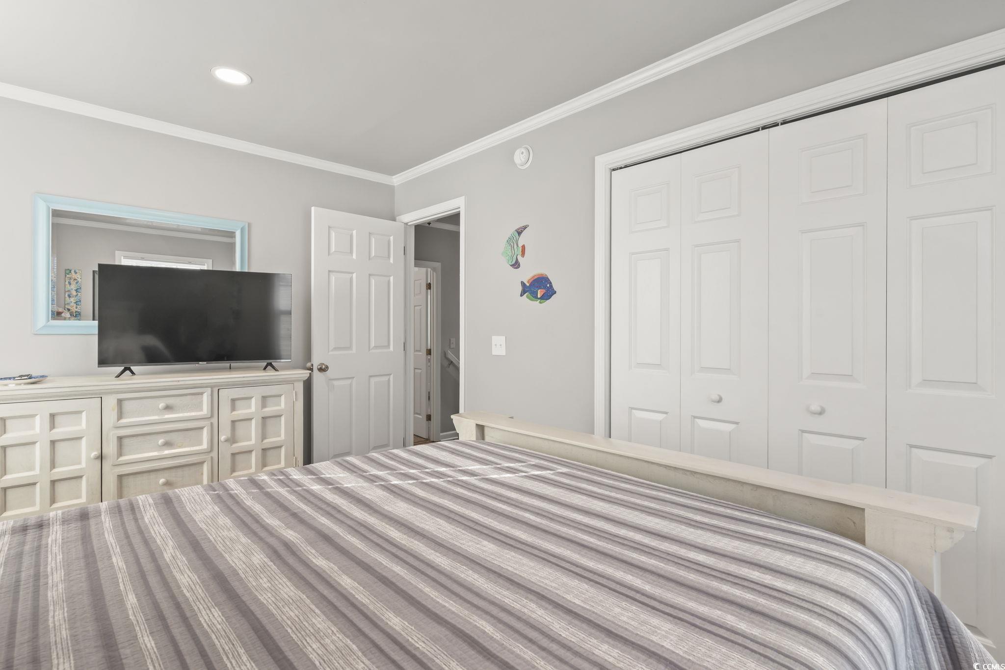 409 Knoll Court Myrtle Beach, SC 29588 - Photo 25 of 33 Bedroom featuring ornamental molding and a closet