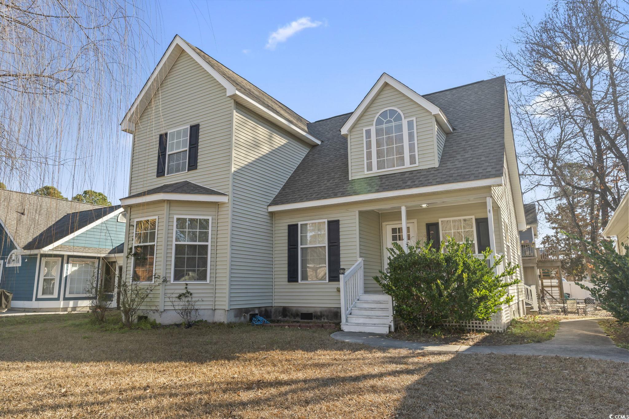 409 Knoll Court Myrtle Beach, SC 29588 - Photo 3 of 33 View of front facade with a shingled roof, covered porch, and a front lawn