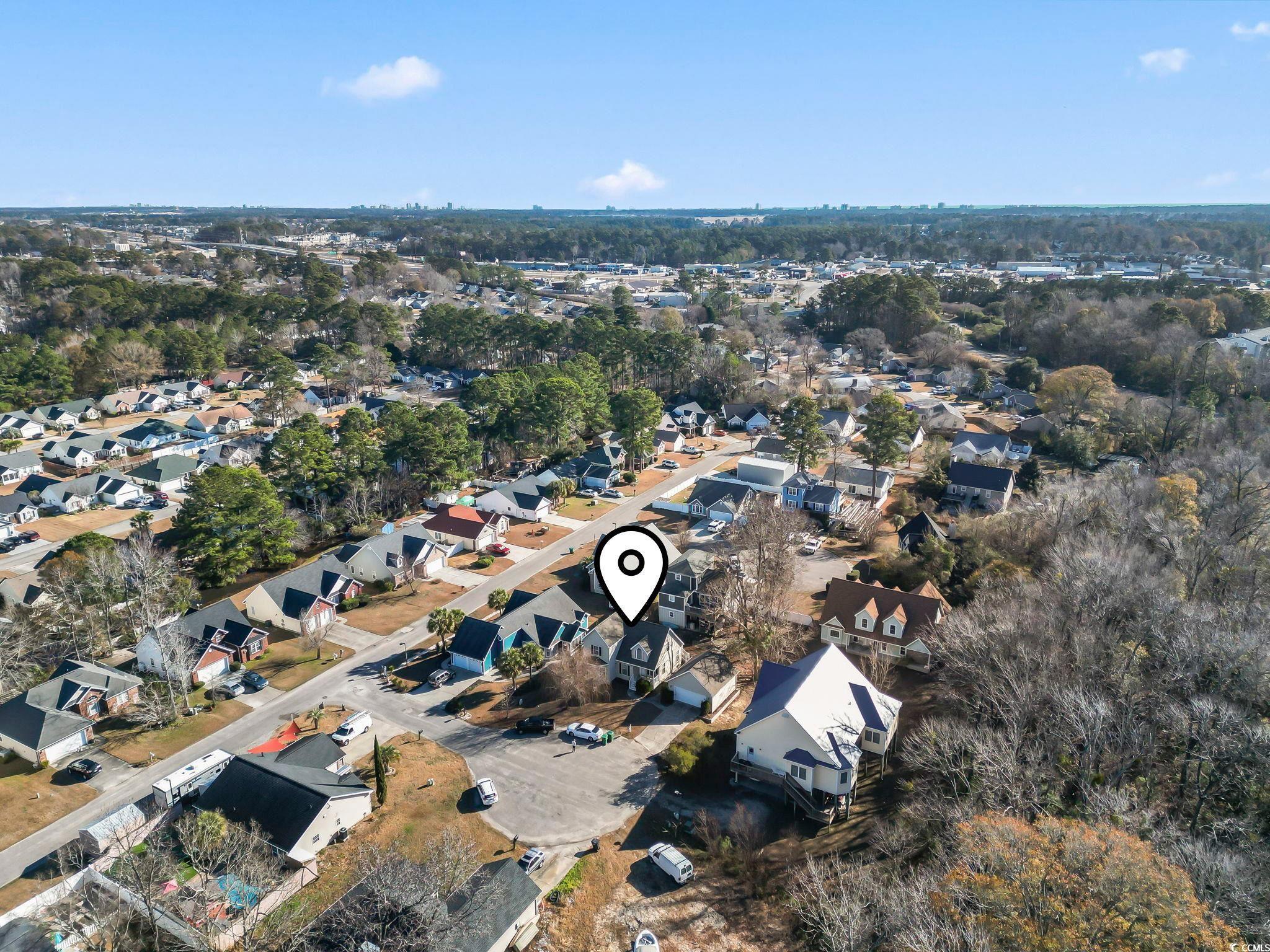 409 Knoll Court Myrtle Beach, SC 29588 - Photo 30 of 33 Aerial view of property's location with nearby suburban area and a tree filled landscape