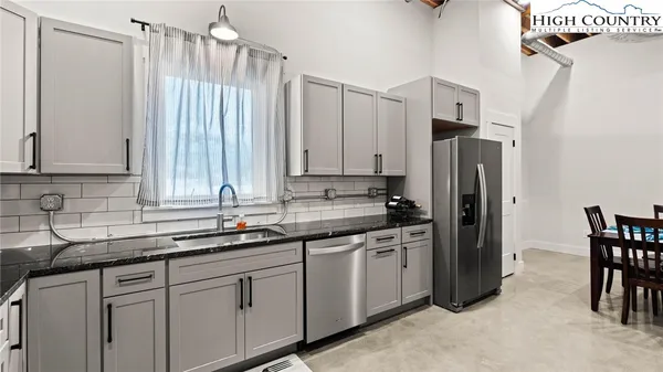 a kitchen with appliances cabinets and a sink