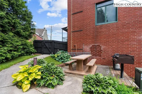 a view of a backyard with sitting area