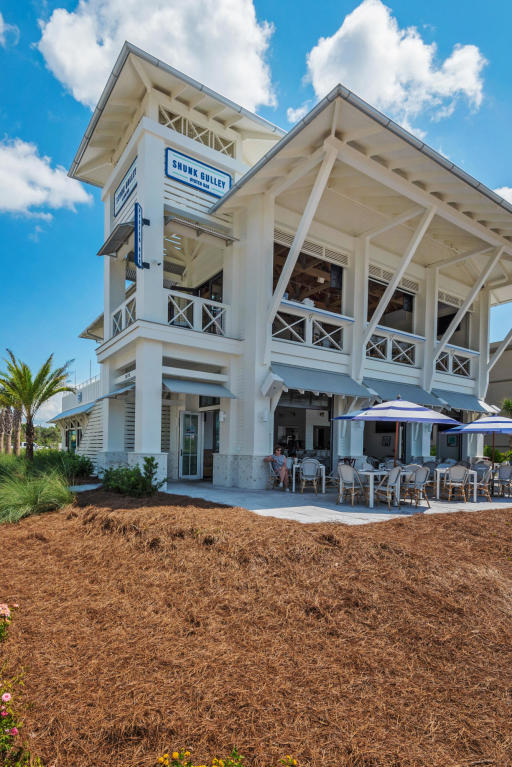 1740 South County Highway, Unit 110 Santa Rosa Beach, FL 32459 - Photo 21 of 22 a front view of a building and a yard